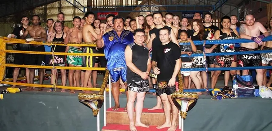 Elite Instructor in Muay Thai and MMA certified internationaly surrounded by Grand Masters 